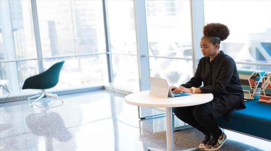 Young Black Female using a computer